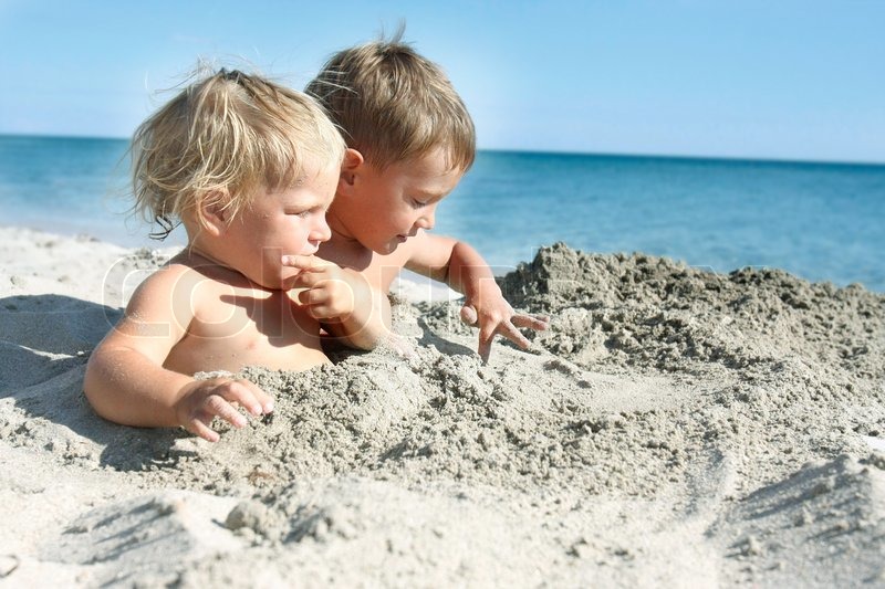 2258558-two-kids-playing-on-sand-beach